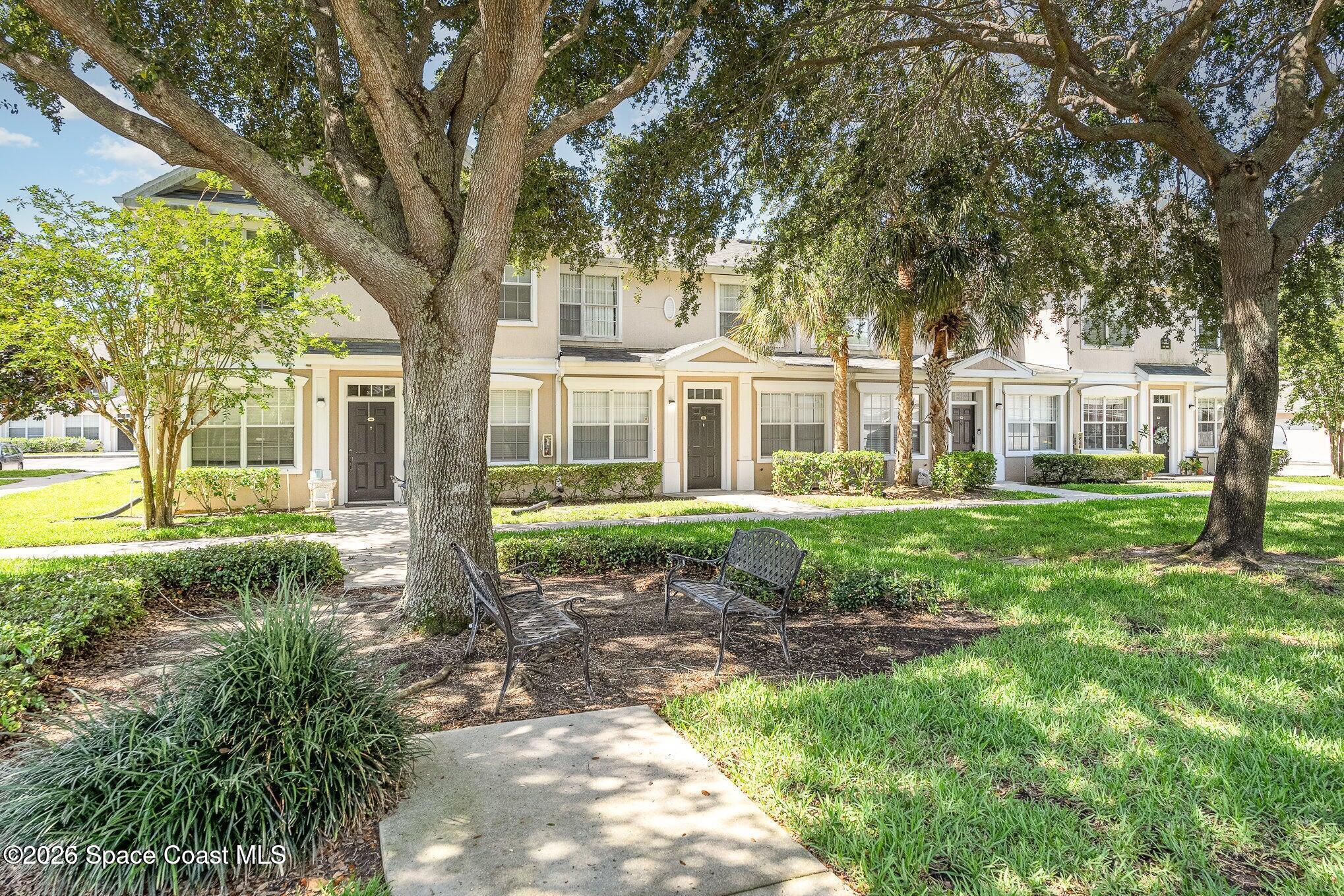 110 Colibri Way, Unit 106 Melbourne, FL 32901 - Photo 3 of 28 front view of a house with a yard