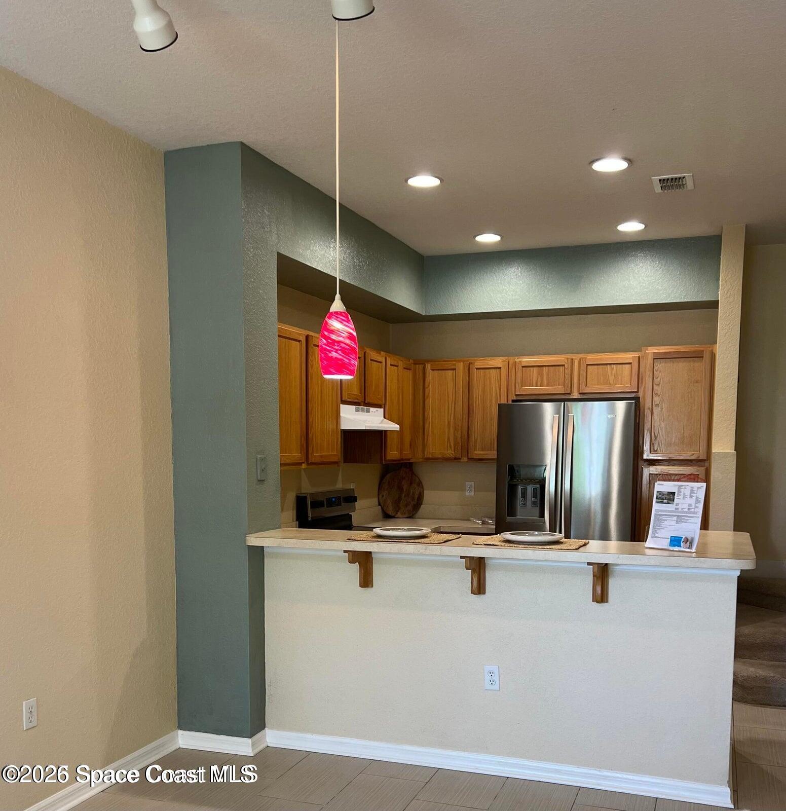 110 Colibri Way, Unit 106 Melbourne, FL 32901 - Photo 7 of 28 a view of living room with furniture and a flat screen tv