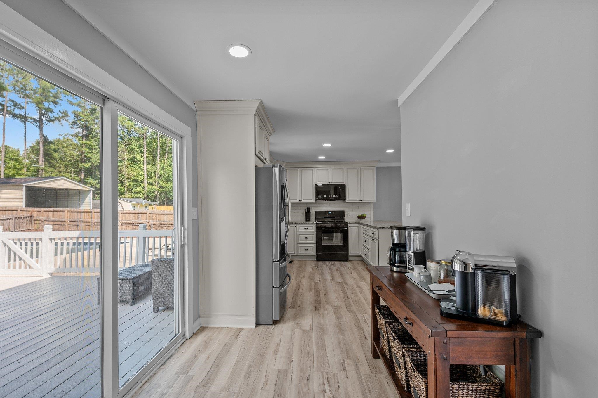 2037 Queen Charlotte Place Raleigh, NC 27610 - Photo 12 of 32 a view of kitchen with furniture and wooden floor