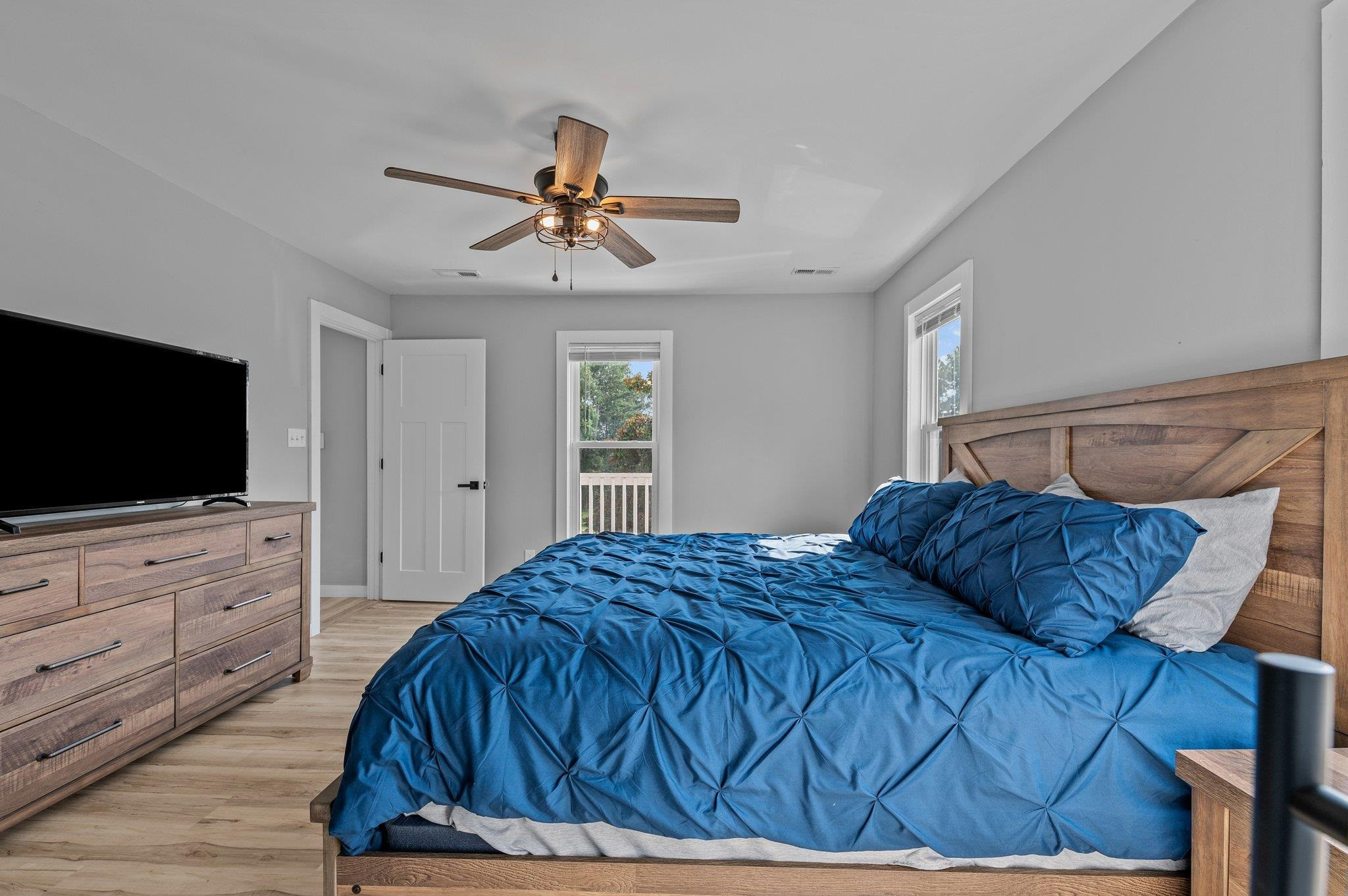 2037 Queen Charlotte Place Raleigh, NC 27610 - Photo 17 of 32 a bedroom with a bed and a flat screen tv