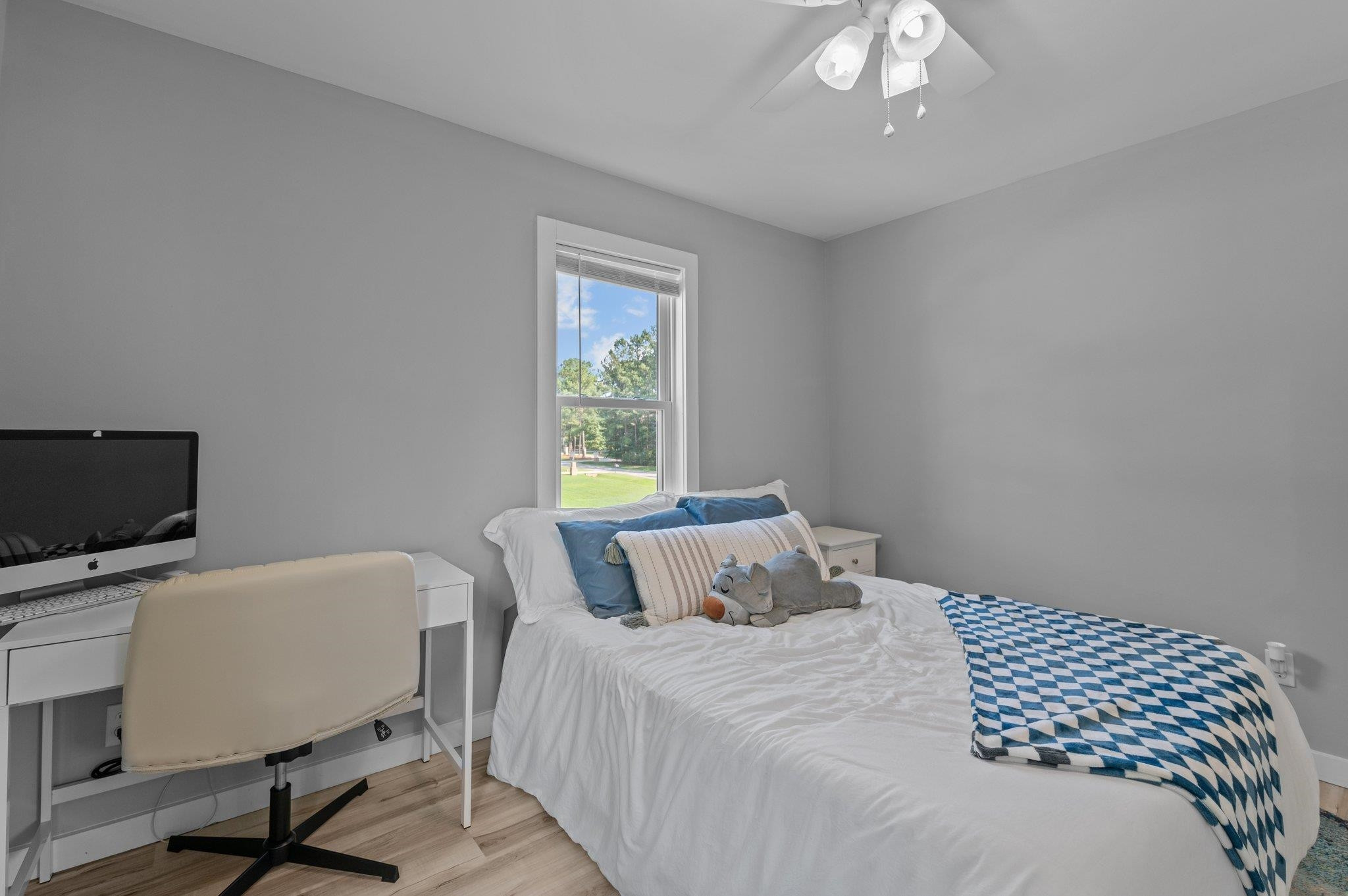 2037 Queen Charlotte Place Raleigh, NC 27610 - Photo 26 of 32 a bedroom with a bed and a desk