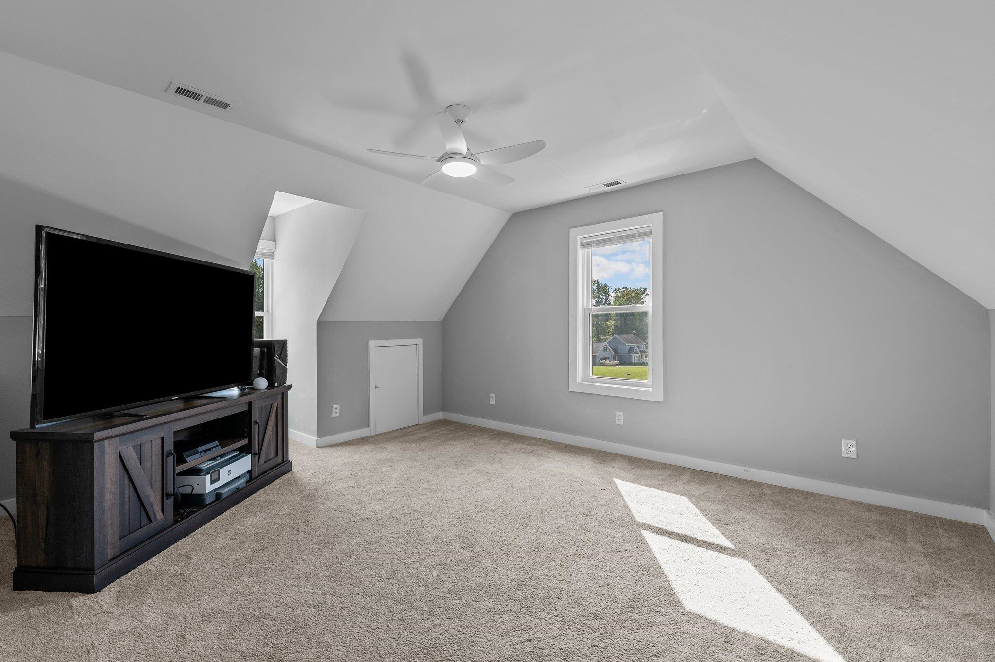 2037 Queen Charlotte Place Raleigh, NC 27610 - Photo 30 of 32 a living room with a flat screen tv a window and a fireplace