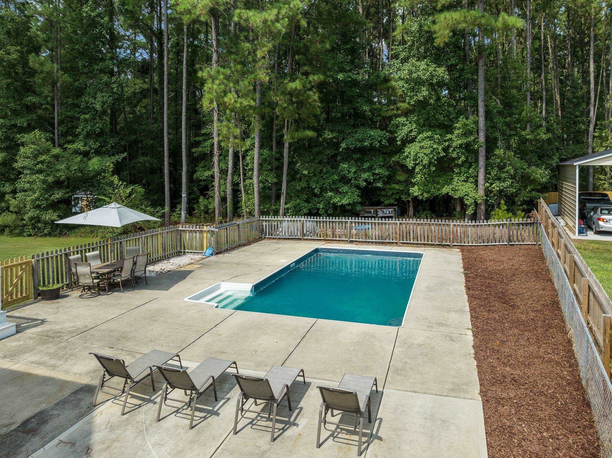 2037 Queen Charlotte Place Raleigh, NC 27610 - Photo 3 of 32 an outdoor space with pool and furniture