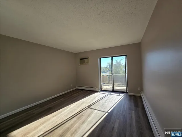 a view of wooden floor in an empty room