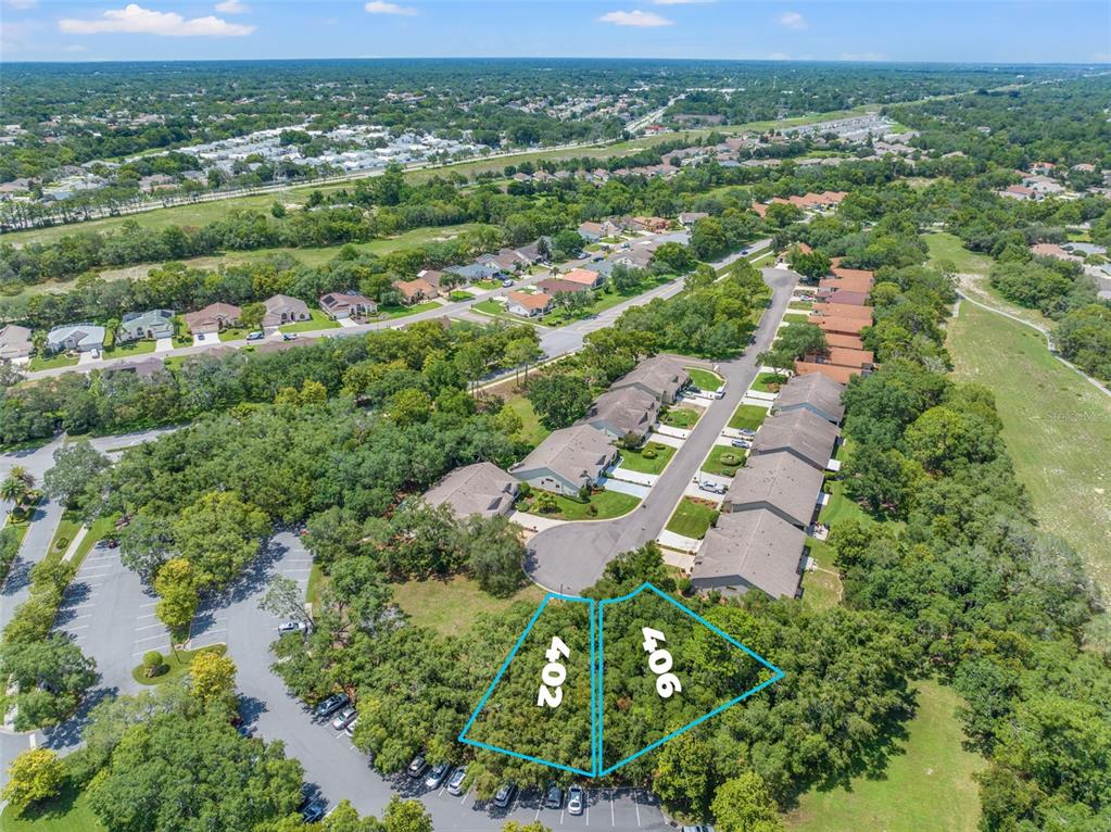 402 Candlestone Court Spring Hill, FL 34609 - Photo 2 of 8 an aerial view of residential houses with outdoor space