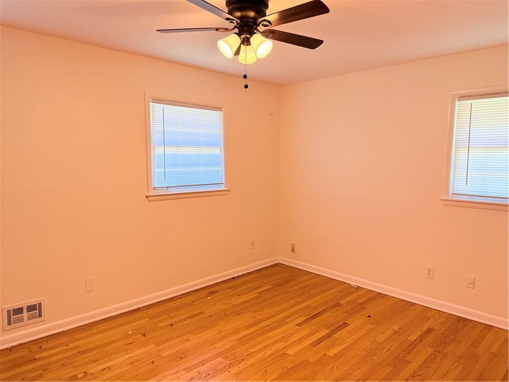 3460 Boring Road Decatur, GA 30034 - Photo 11 of 16 an empty room with a window and a ceiling fan