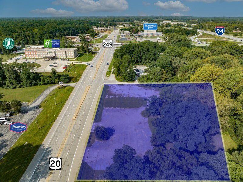 6340 Melton Road Portage, IN 46368 - Photo 3 of 6 a view of a lake with a yard