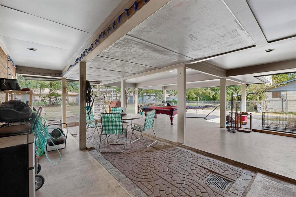 418 Hillside Drive Gainesville, TX 76240 - Photo 32 of 39 a view of a porch with chairs and backyard