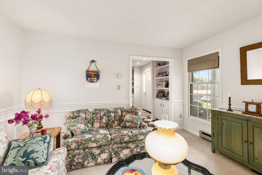 1115 Chapel Road Middletown, VA 22645 - Photo 16 of 54 a living room with furniture and a table