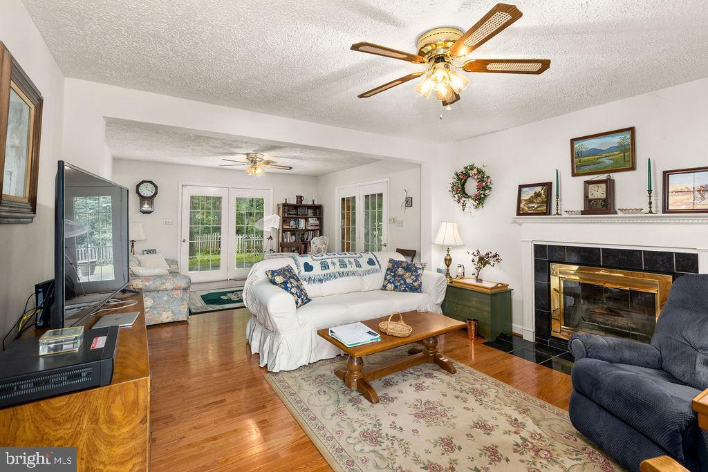 1115 Chapel Road Middletown, VA 22645 - Photo 17 of 54 a living room with furniture fireplace and a large window