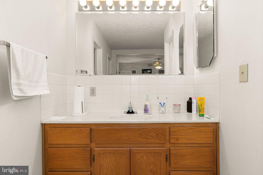 1115 Chapel Road Middletown, VA 22645 - Photo 33 of 54 a bathroom with a sink vanity and mirror