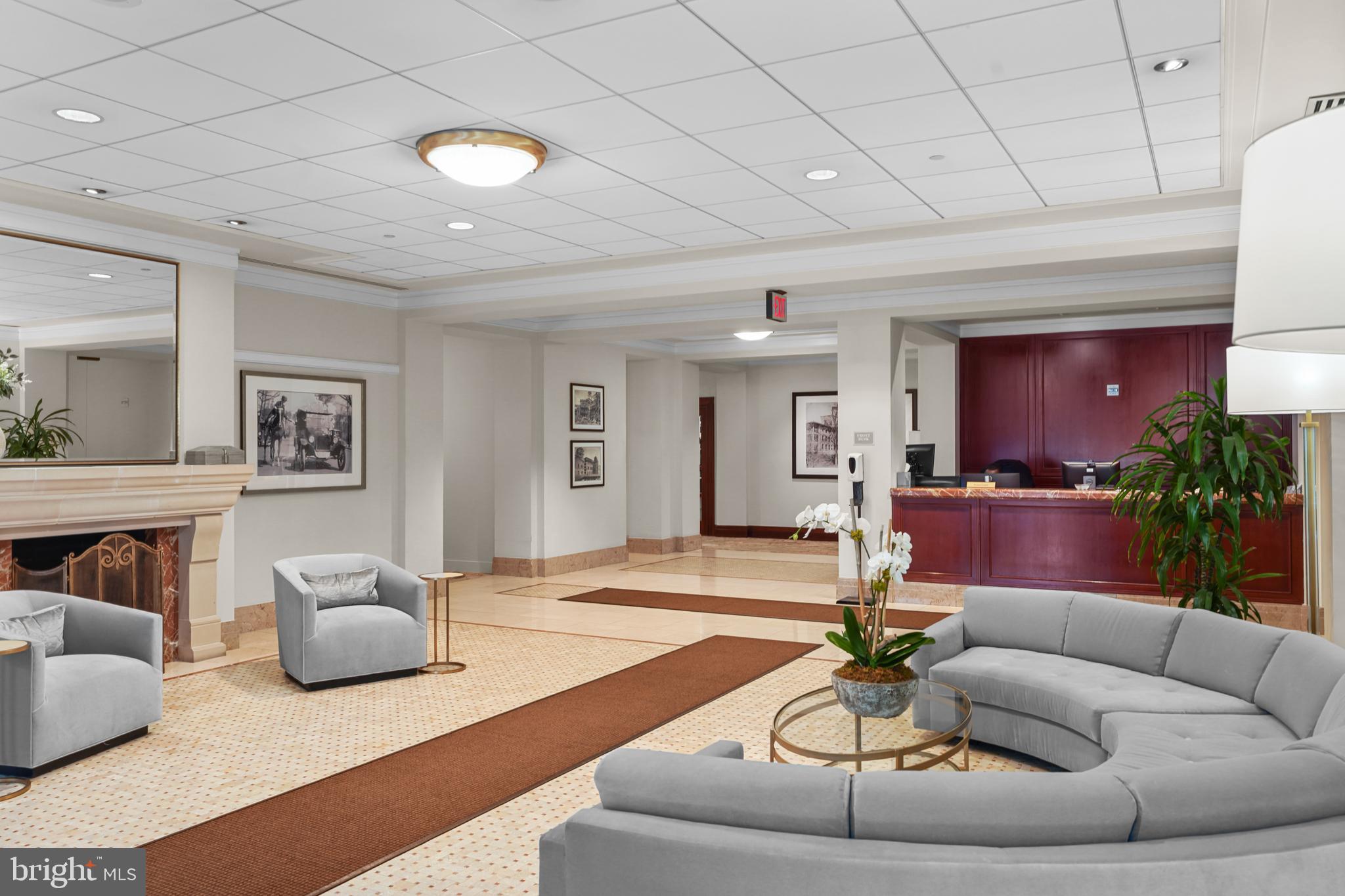 2425 L Street Northwest, Unit 431 Washington, DC 20037 - Photo 4 of 29 a living room with furniture and a wooden floor