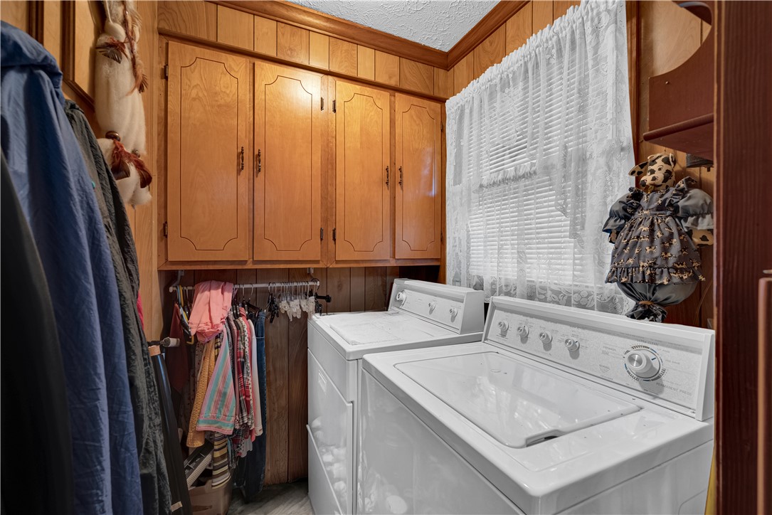 307 Calhoun Road Belton, SC 29627 - Photo 25 of 30 Functional laundry space featuring durable appliances and built-in cabinetry.