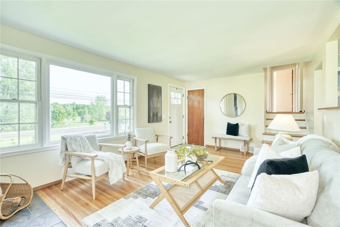 1815 Woodard Road Webster, NY 14580 - Photo 9 of 45 LIVING ROOM . . VIEW TO FRONT ENTRANCE & GUEST CO