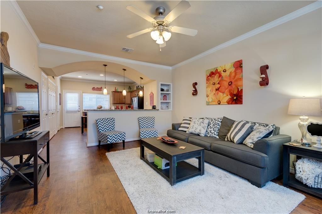 1198 Jones-Butler Road, Unit 406 College Station, TX 77840 - Photo 2 of 12 a living room with furniture and a flat screen tv