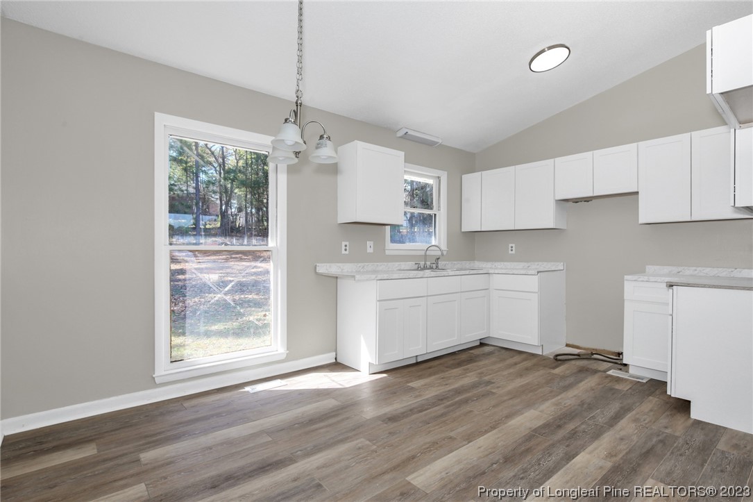 3319 Hedgemoor Circle Spring Lake, NC 28390 - Photo 11 of 30 a kitchen with white cabinets and white appliances