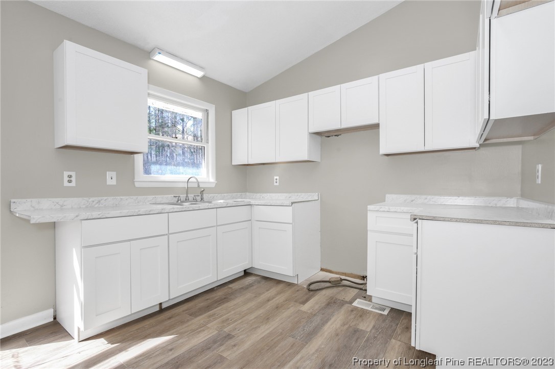 3319 Hedgemoor Circle Spring Lake, NC 28390 - Photo 12 of 30 a kitchen with a sink cabinets and window