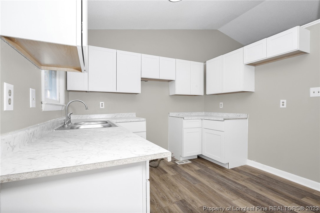 3319 Hedgemoor Circle Spring Lake, NC 28390 - Photo 14 of 30 a kitchen with a sink stove and cabinets