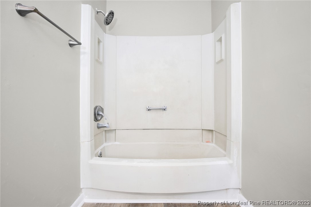 3319 Hedgemoor Circle Spring Lake, NC 28390 - Photo 21 of 30 a white bath tub sitting next to a white sink and vanity