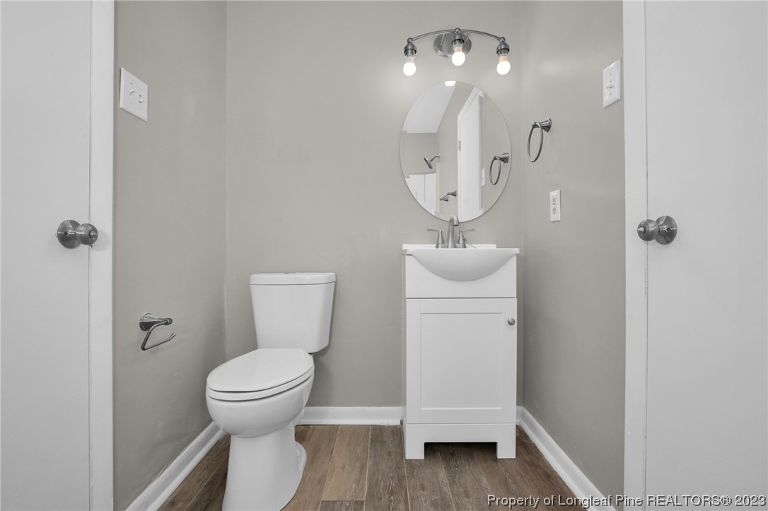 3319 Hedgemoor Circle Spring Lake, NC 28390 - Photo 22 of 30 a bathroom with a toilet and a mirror