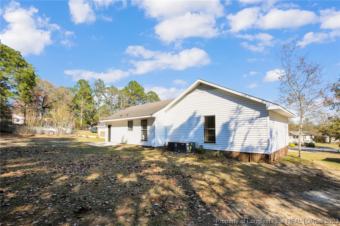 3319 Hedgemoor Circle Spring Lake, NC 28390 - Photo 28 of 30 a view of a house with a yard