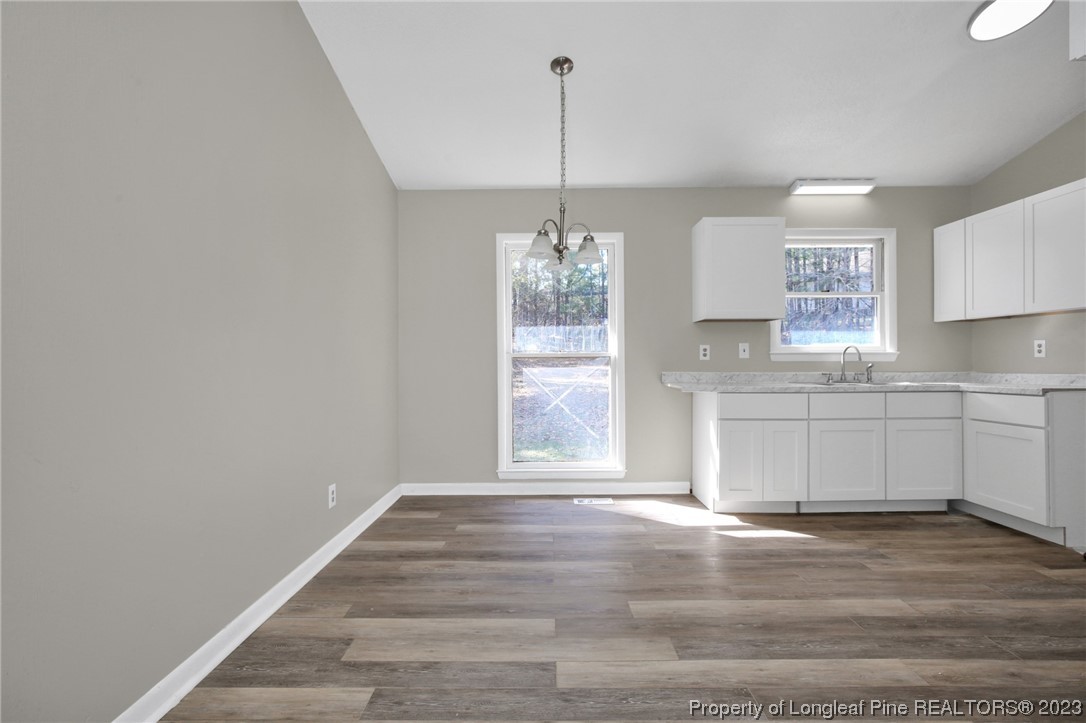 3319 Hedgemoor Circle Spring Lake, NC 28390 - Photo 9 of 30 a kitchen with a refrigerator and window