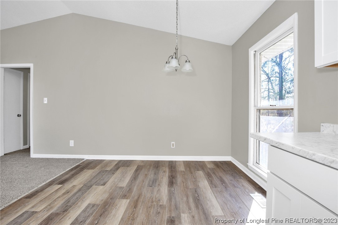 3319 Hedgemoor Circle Spring Lake, NC 28390 - Photo 10 of 30 a view of a room with wooden floor and windows