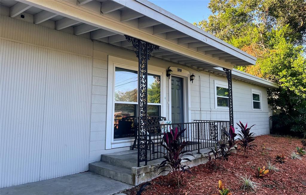 5910 Indian Hill Road Orlando, FL 32808 - Photo 2 of 12 a view of house with patio outdoor seating area