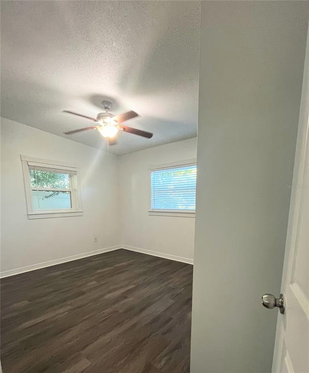 5910 Indian Hill Road Orlando, FL 32808 - Photo 8 of 12 a view of a room with wooden floor