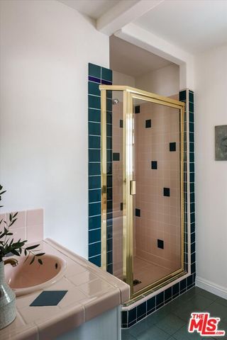 a bathroom with a tub and shower