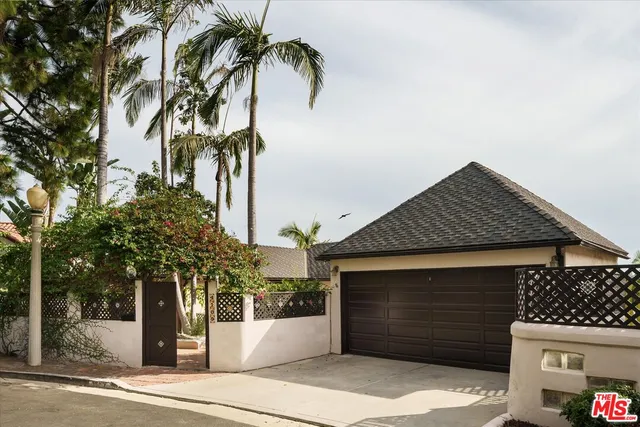 a front view of a house with a garage