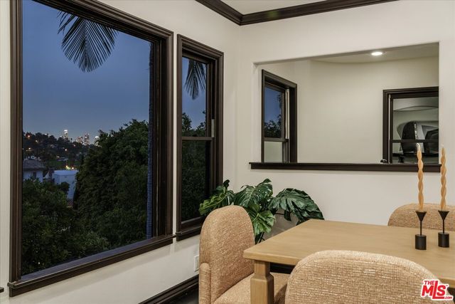 a balcony with table and chairs