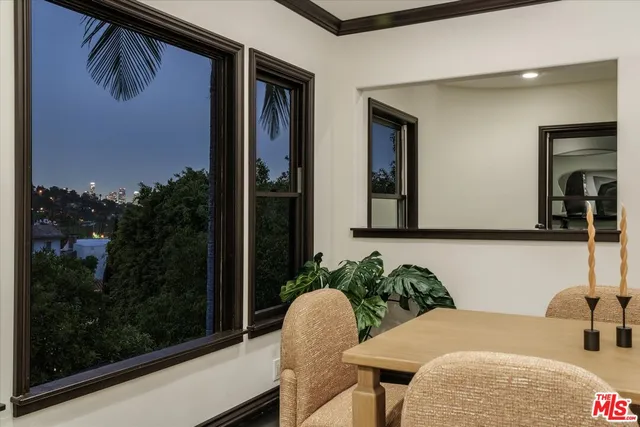 a balcony with table and chairs