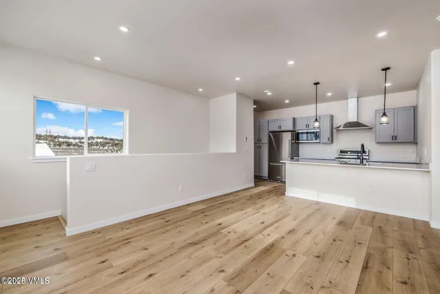 a view of kitchen with wooden floor