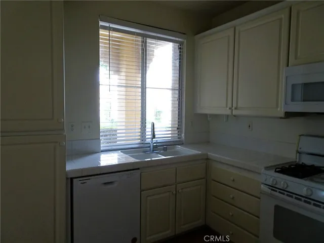 a kitchen with sink and window
