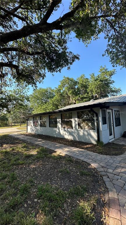 5160 Haywood Ruffin Road St. Cloud, FL 34771 - Photo 13 of 39 a view of a house with a back yard