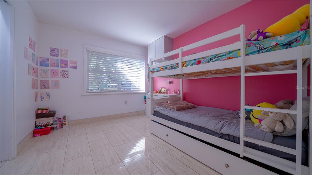 5160 Haywood Ruffin Road St. Cloud, FL 34771 - Photo 26 of 39 a bedroom with a bed and a window