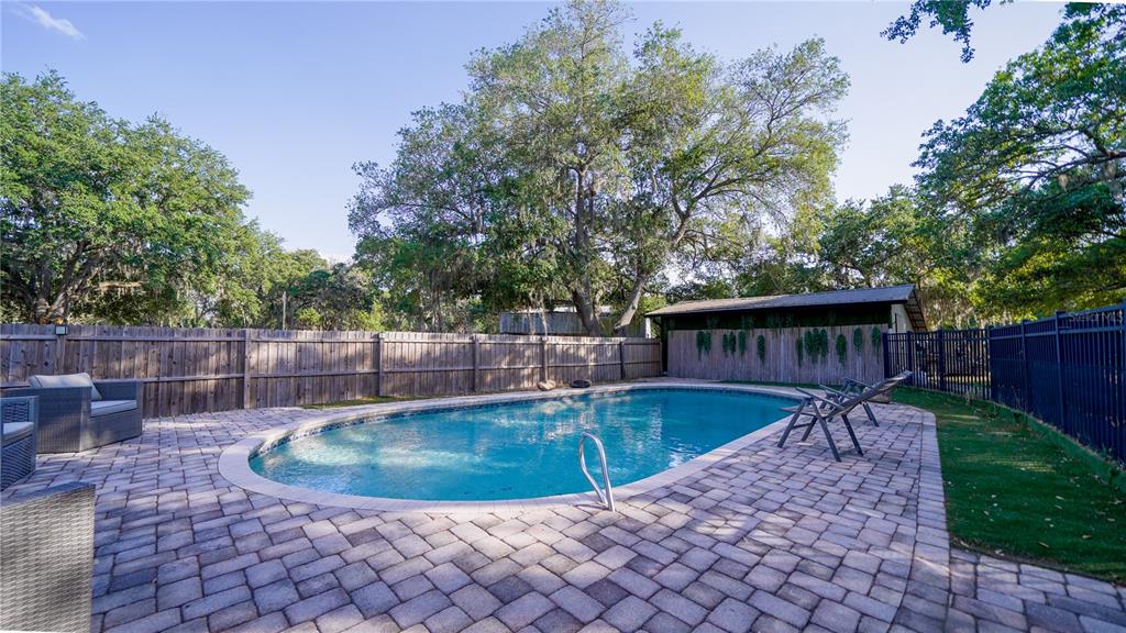 5160 Haywood Ruffin Road St. Cloud, FL 34771 - Photo 4 of 39 a view of a backyard with swimming pool
