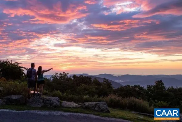 an aerial view of residential house with outdoor space and river