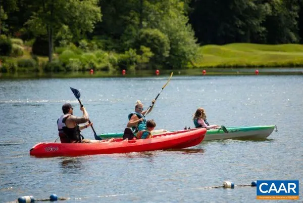 a aerial view of a house with swimming pool patio and outdoor seating