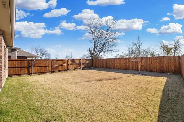 a view of basketball place with wooden fence