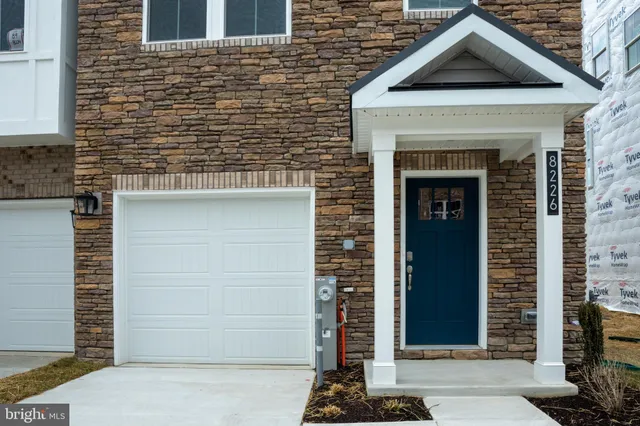 a front view of a house with a garage