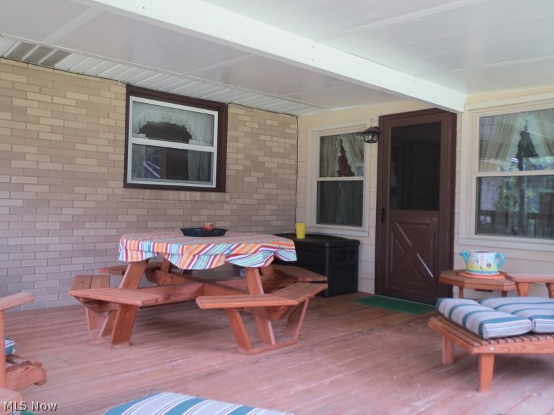 1204 Oak Tree Road Akron, OH 44320 - Photo 10 of 25 OUTDOOR ENTERTAINING AT ITS' BEST COVERED DECK OVERLOOKS BIG BACKYARD!