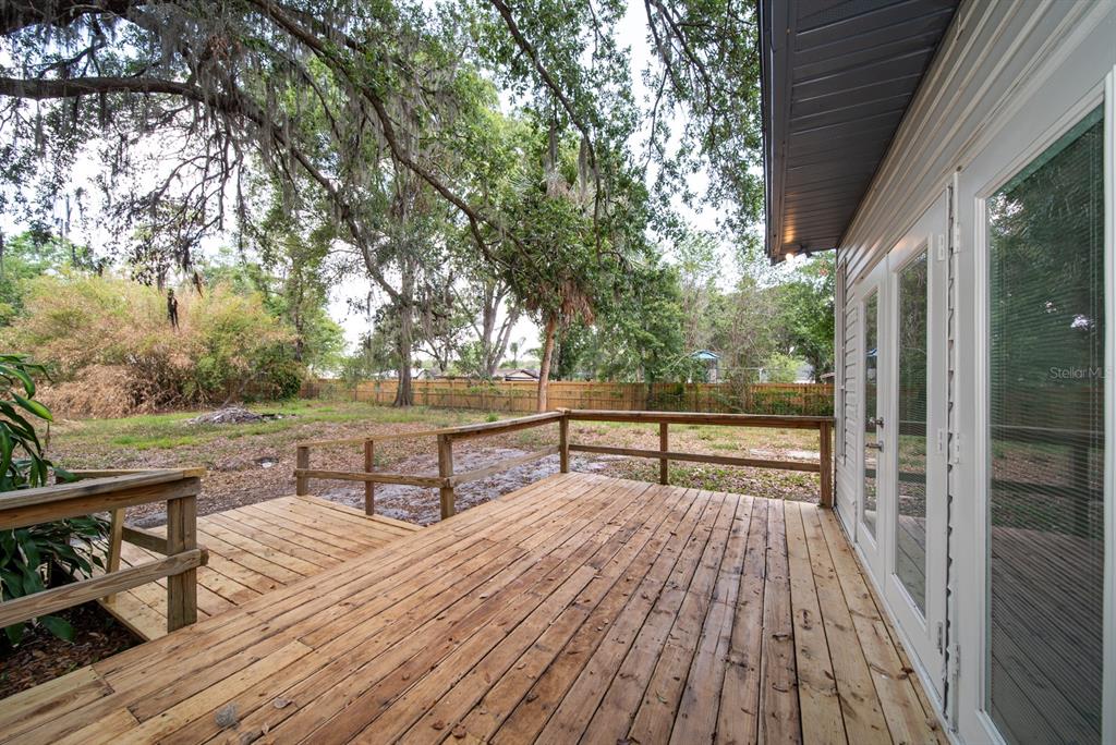 6345 Hatcher Road Lakeland, FL 33811 - Photo 21 of 41 a view of a terrace with wooden floor and outdoor seating