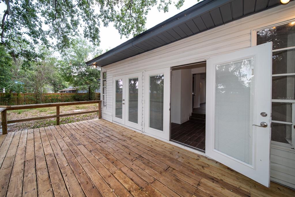 6345 Hatcher Road Lakeland, FL 33811 - Photo 22 of 41 a view of backyard with wooden floor and fence
