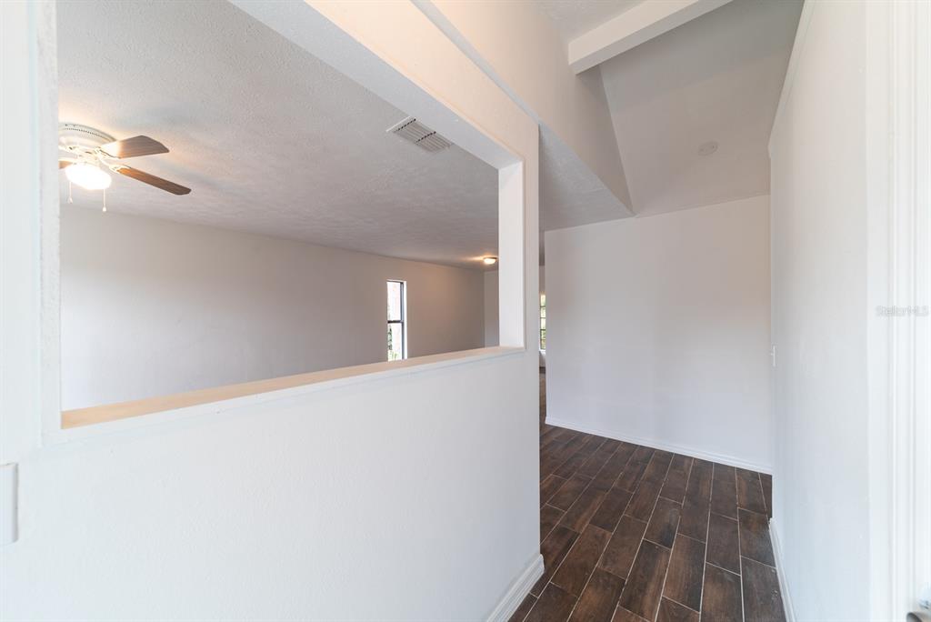 6345 Hatcher Road Lakeland, FL 33811 - Photo 24 of 41 a view of a hallway with wooden floor