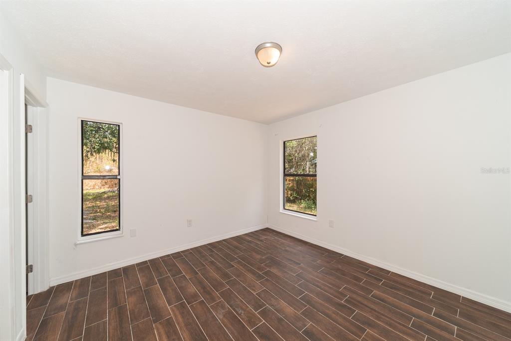 6345 Hatcher Road Lakeland, FL 33811 - Photo 27 of 41 an empty room with windows