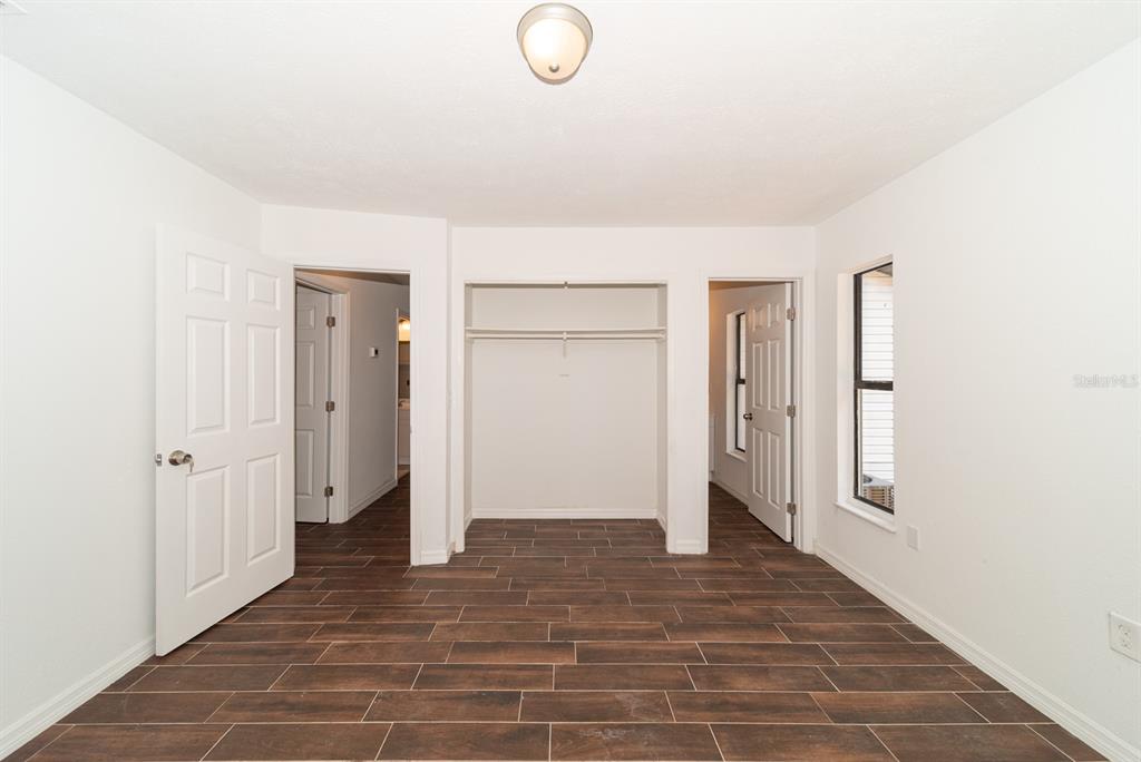 6345 Hatcher Road Lakeland, FL 33811 - Photo 28 of 41 a view of a room with wooden floor and cabinet