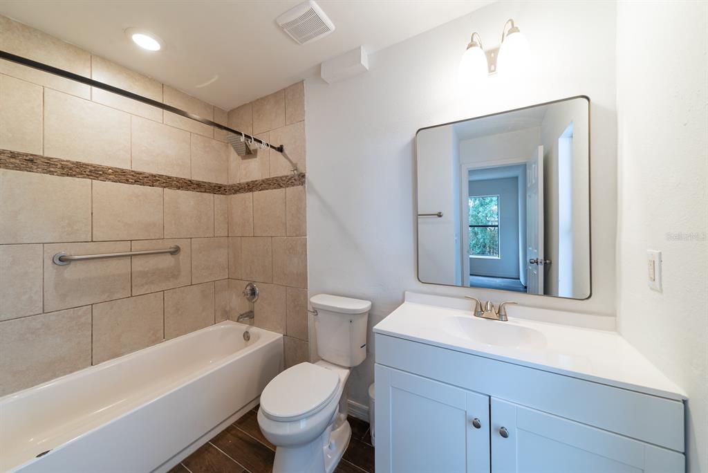 6345 Hatcher Road Lakeland, FL 33811 - Photo 29 of 41 a bathroom with a sink a toilet and a bathtub