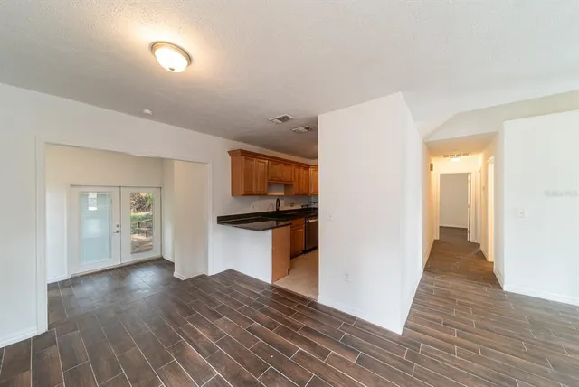 a view of a kitchen from the hallway